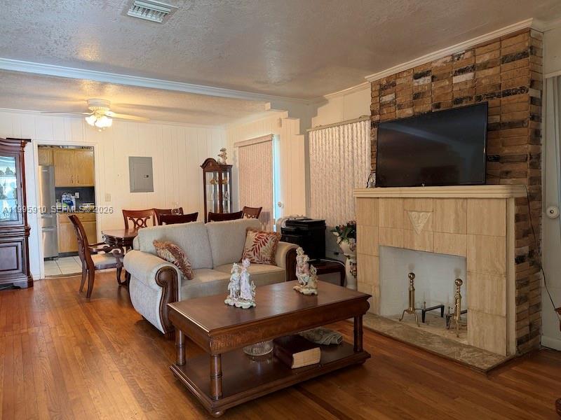 446 Northwest 45th Street Miami, FL 33127 - Photo 6 of 15 a living room with furniture and a fireplace