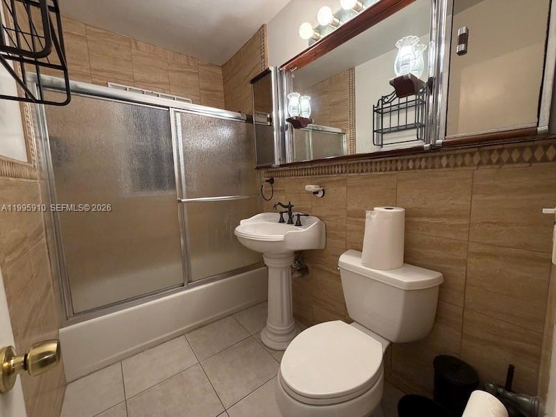 446 Northwest 45th Street Miami, FL 33127 - Photo 7 of 15 a bathroom with a toilet sink and shower