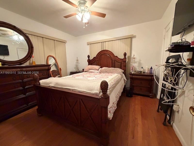 446 Northwest 45th Street Miami, FL 33127 - Photo 8 of 15 a bedroom with a bed and a flat tv screen on the dresser