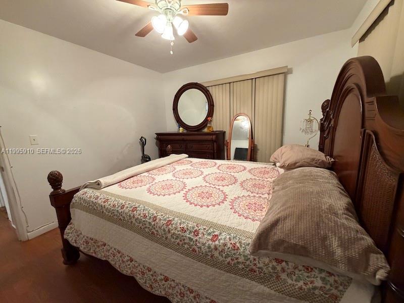 446 Northwest 45th Street Miami, FL 33127 - Photo 9 of 15 a bed sitting in a bedroom next to a window