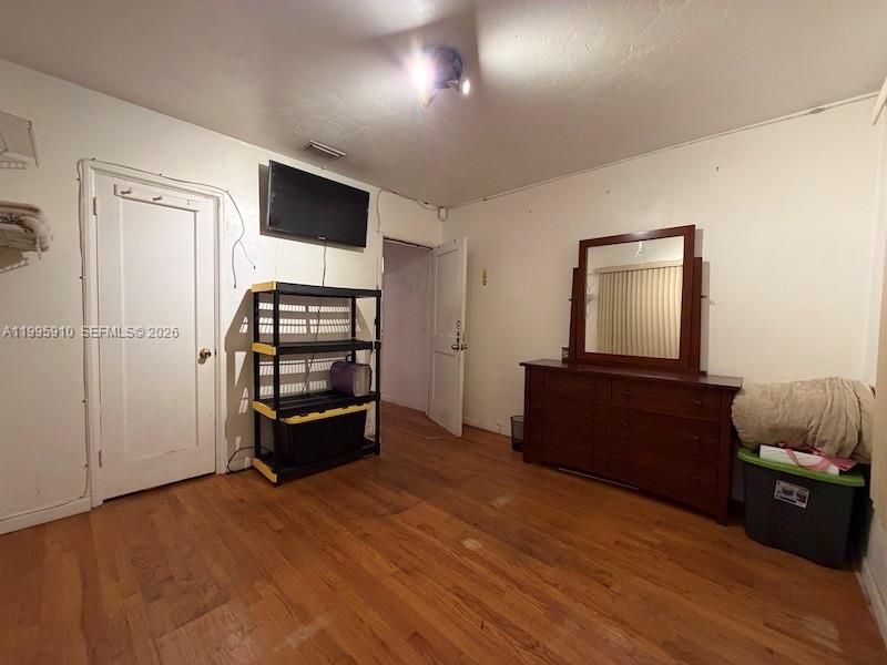 446 Northwest 45th Street Miami, FL 33127 - Photo 10 of 15 a living room with furniture and a flat screen tv