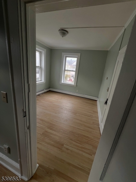 193 President Street, Unit 9 Passaic, NJ 07055 - Photo 7 of 10 a view of hallway with window and stairs