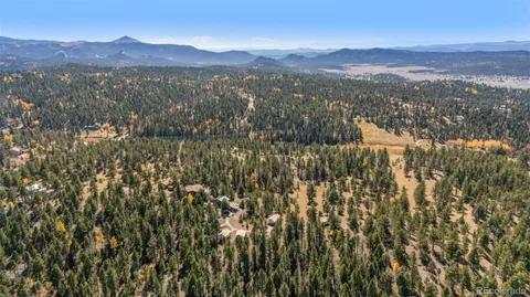 a view of a town with mountains in the background