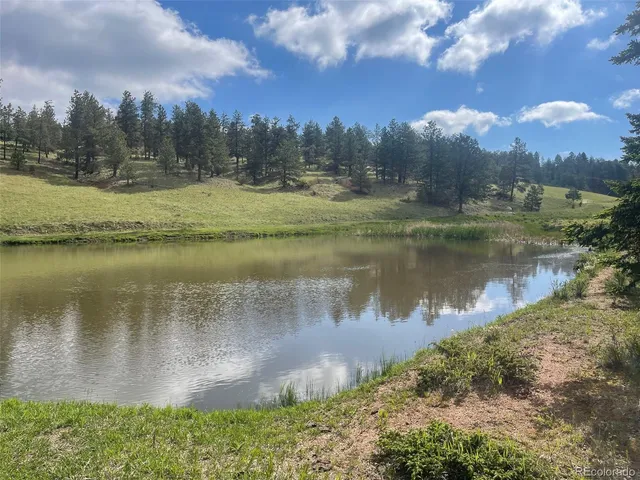 a view of a lake with a yard