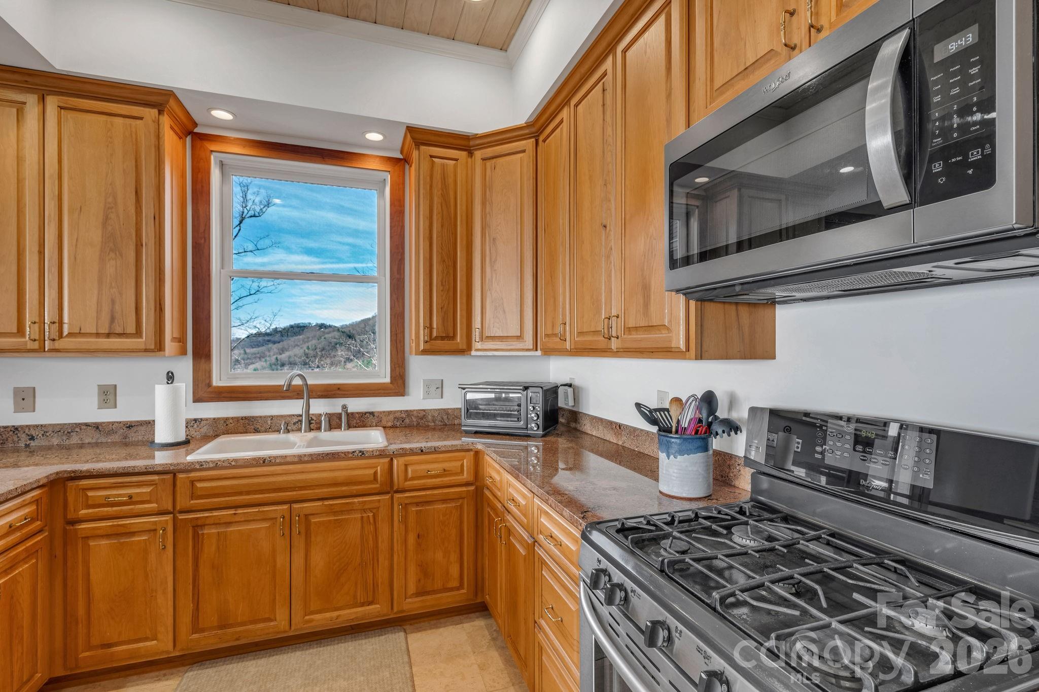 933 Thunder Ridge Lane, Unit 4 & 2 Lenoir, NC 28645 - Photo 15 of 45 a kitchen with stainless steel appliances sink stove and cabinets