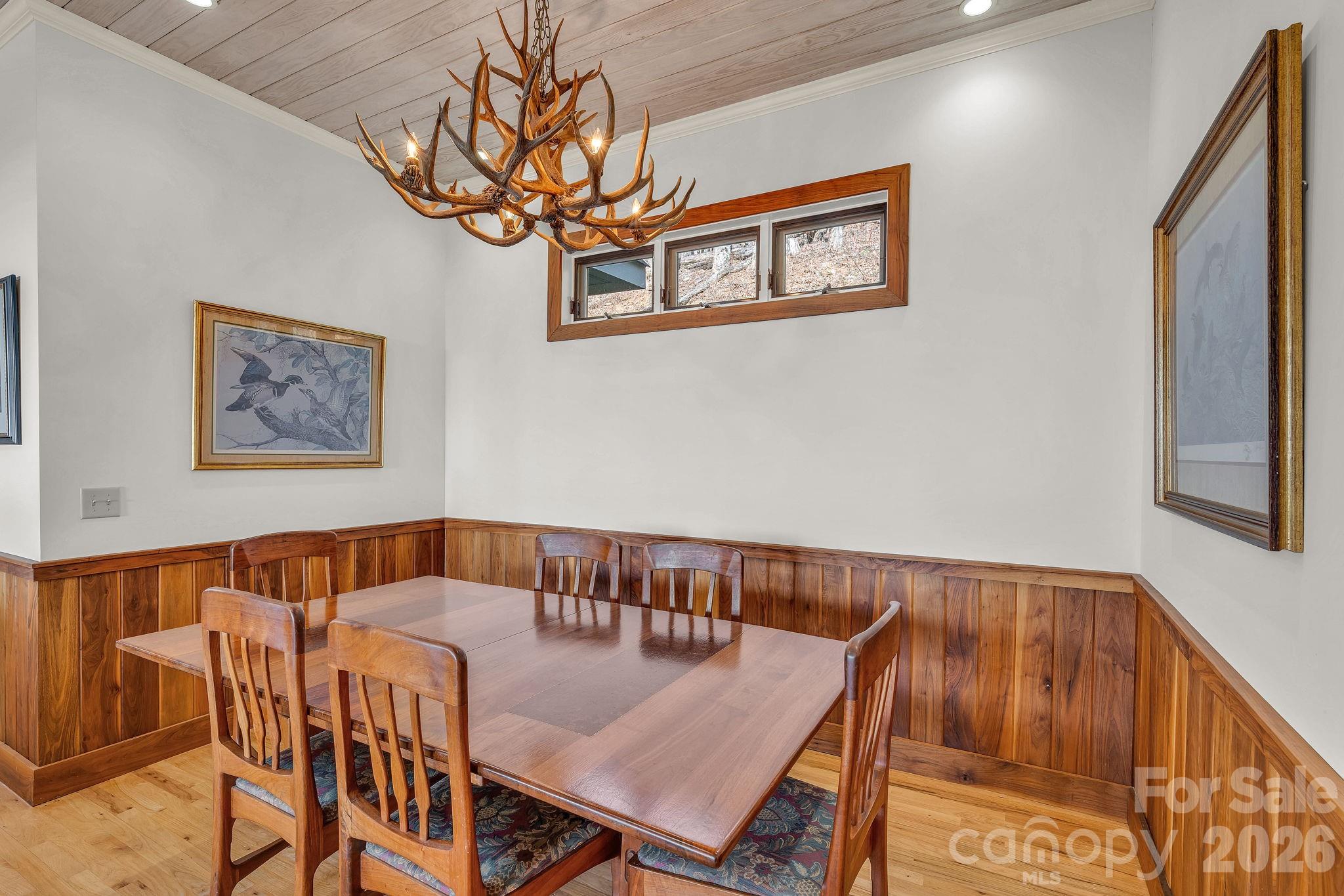 933 Thunder Ridge Lane, Unit 4 & 2 Lenoir, NC 28645 - Photo 16 of 45 a view of a dining room with furniture and a chandelier