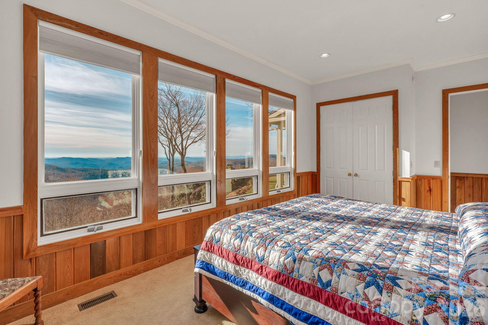 933 Thunder Ridge Lane, Unit 4 & 2 Lenoir, NC 28645 - Photo 29 of 45 a bedroom with a bed and a large window with outer view