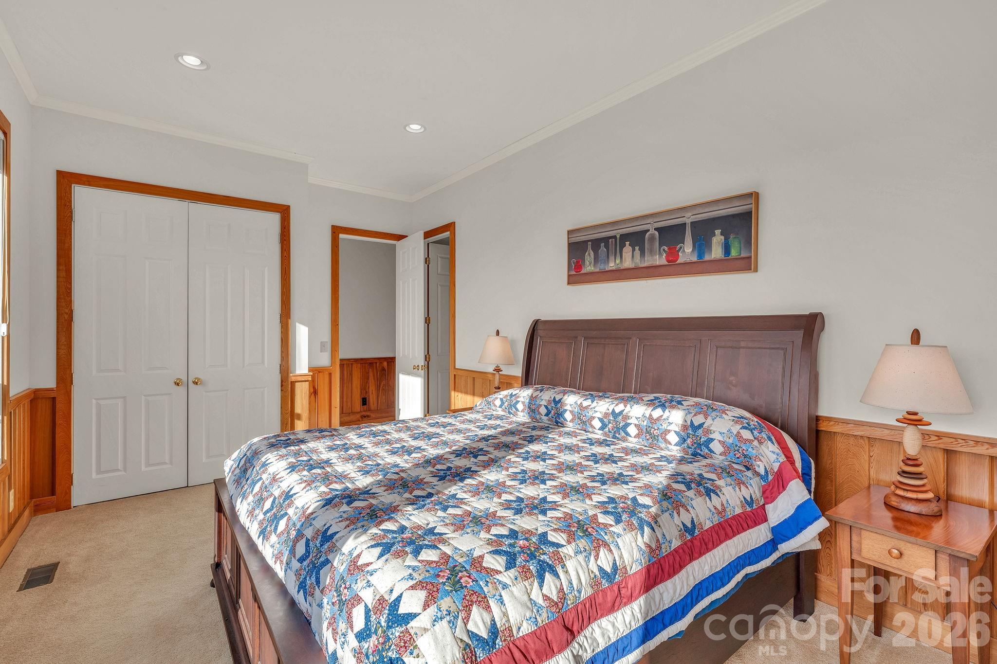 933 Thunder Ridge Lane, Unit 4 & 2 Lenoir, NC 28645 - Photo 30 of 45 a bedroom with a large bed and a lamp