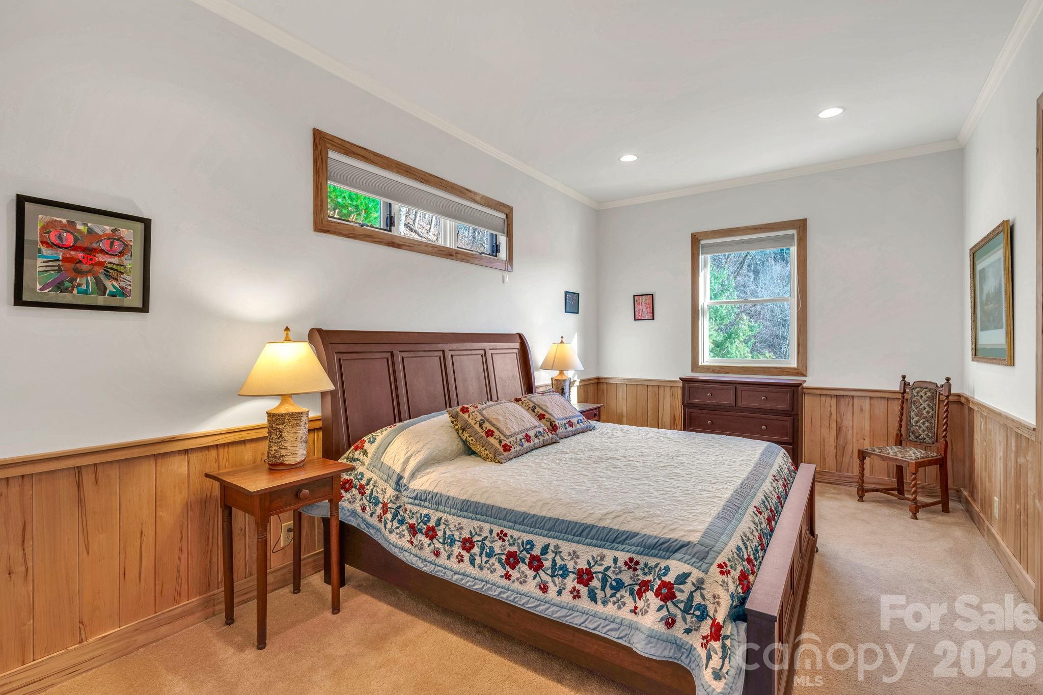 933 Thunder Ridge Lane, Unit 4 & 2 Lenoir, NC 28645 - Photo 33 of 45 a bedroom with a bed a table and painting on the wall