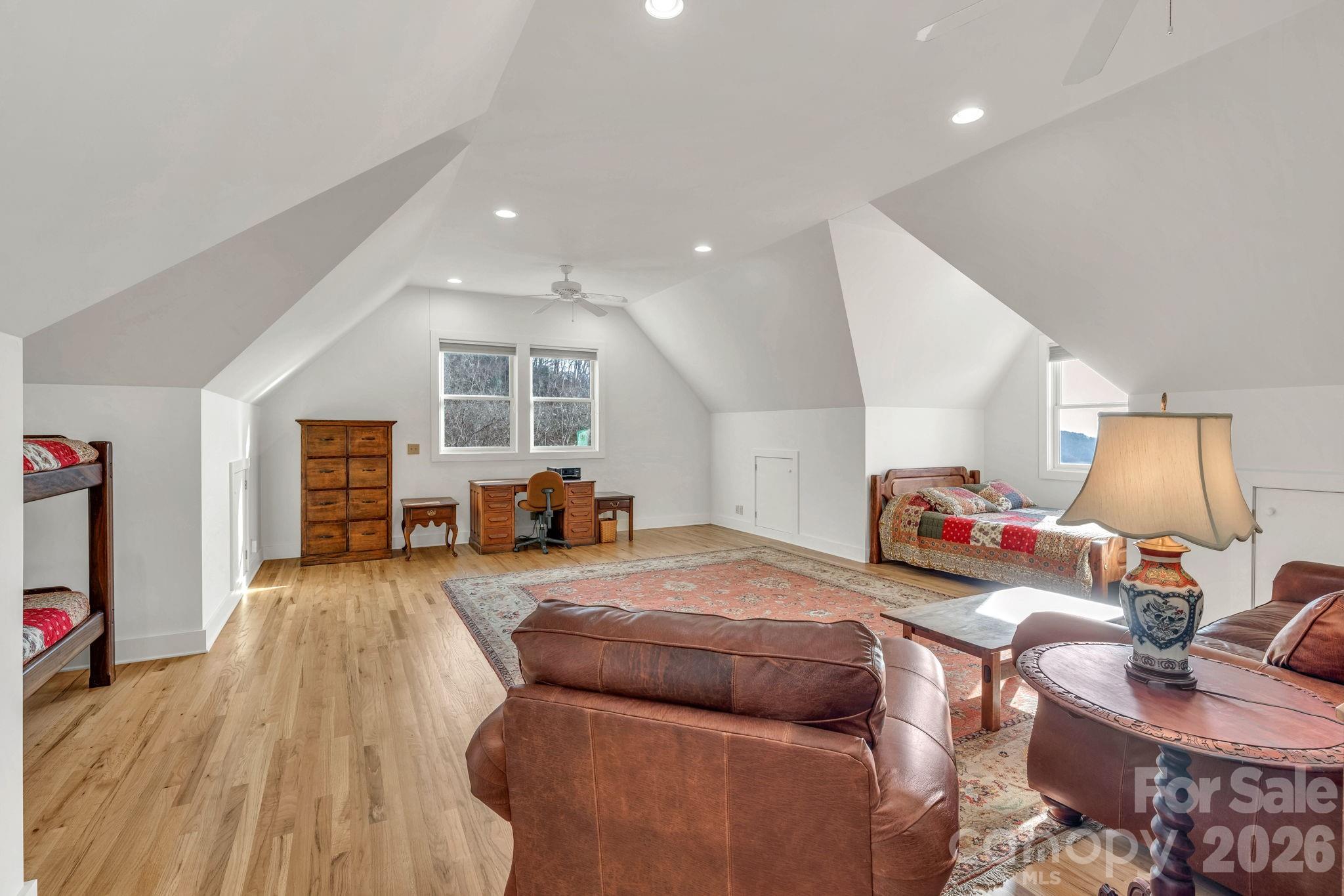 933 Thunder Ridge Lane, Unit 4 & 2 Lenoir, NC 28645 - Photo 38 of 45 a bedroom with furniture and a wooden floor