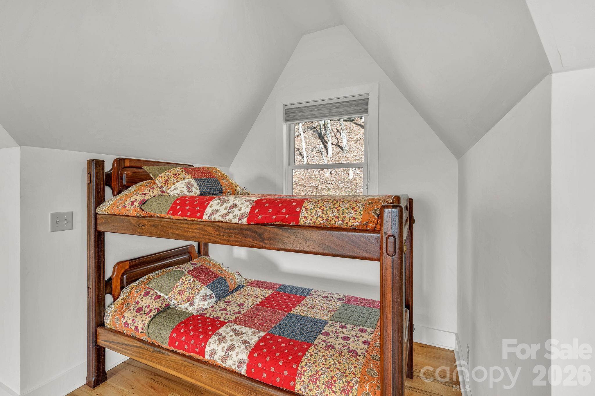 933 Thunder Ridge Lane, Unit 4 & 2 Lenoir, NC 28645 - Photo 41 of 45 a bed sitting in a bedroom next to a window