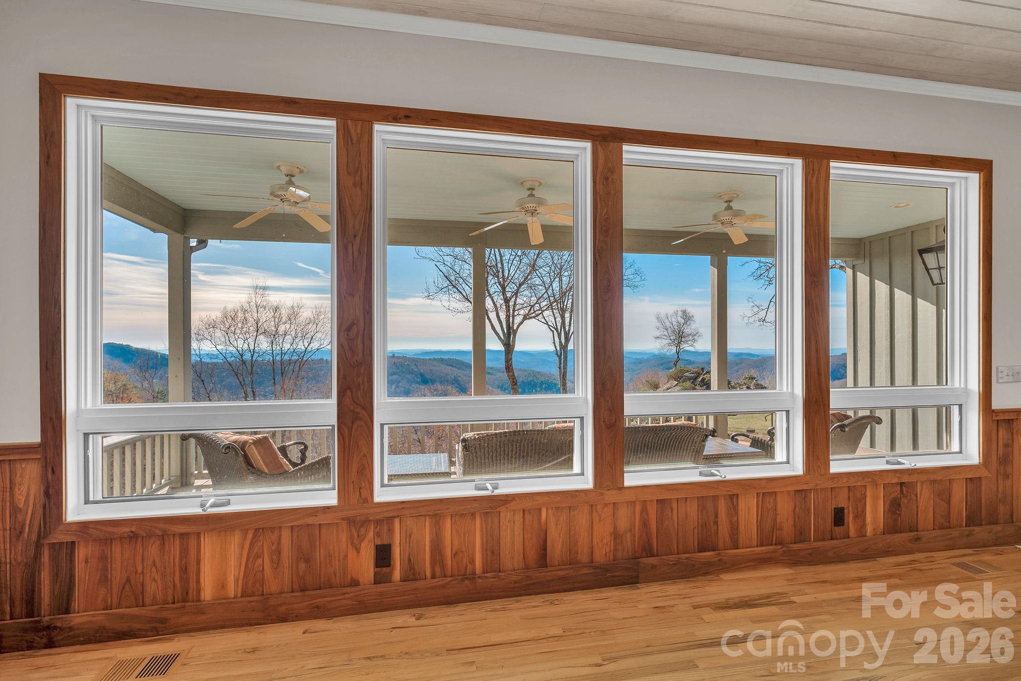 933 Thunder Ridge Lane, Unit 4 & 2 Lenoir, NC 28645 - Photo 5 of 45 a view of a living room area with wooden floor and a large window