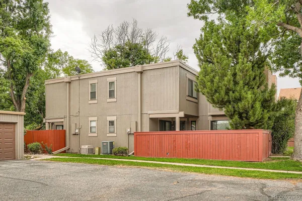 a view of building with yard in front of it