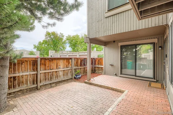 a view of a house with a wooden deck