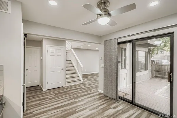 wooden floor in an empty room with a mirror