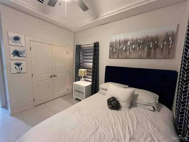 a bedroom with a bed and glass top