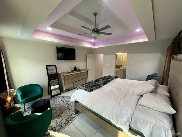 a living room with furniture and a mirror