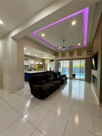 a large living room with a large mirror and furniture