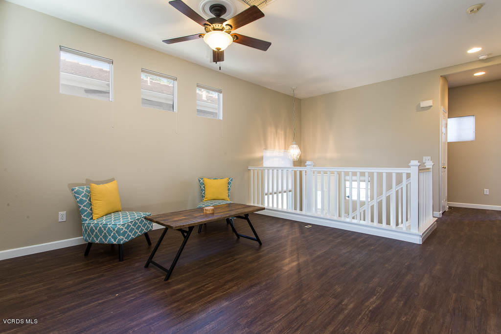 74 Bending Branch Way Simi Valley, CA 93065 - Photo 3 of 41 a view of a workspace with furniture and wooden floor