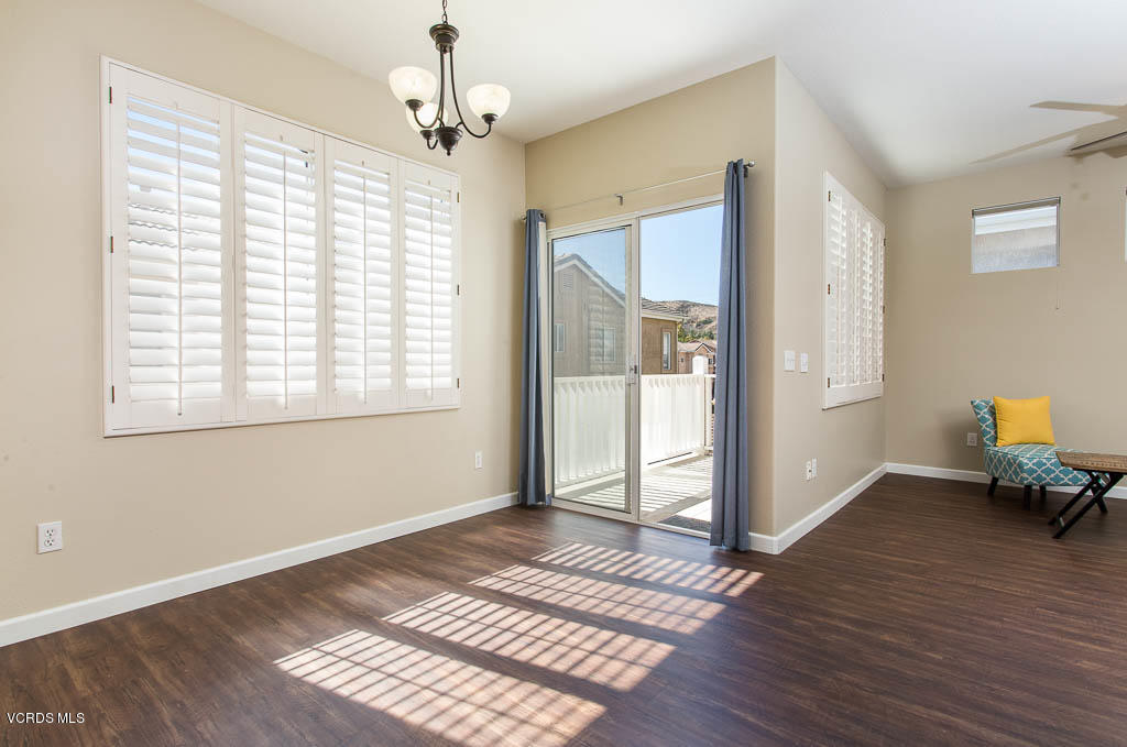 74 Bending Branch Way Simi Valley, CA 93065 - Photo 23 of 41 a view of an empty room with wooden floor and a window