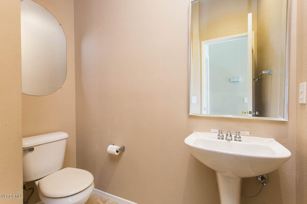 74 Bending Branch Way Simi Valley, CA 93065 - Photo 27 of 41 a bathroom with a sink a toilet and mirror