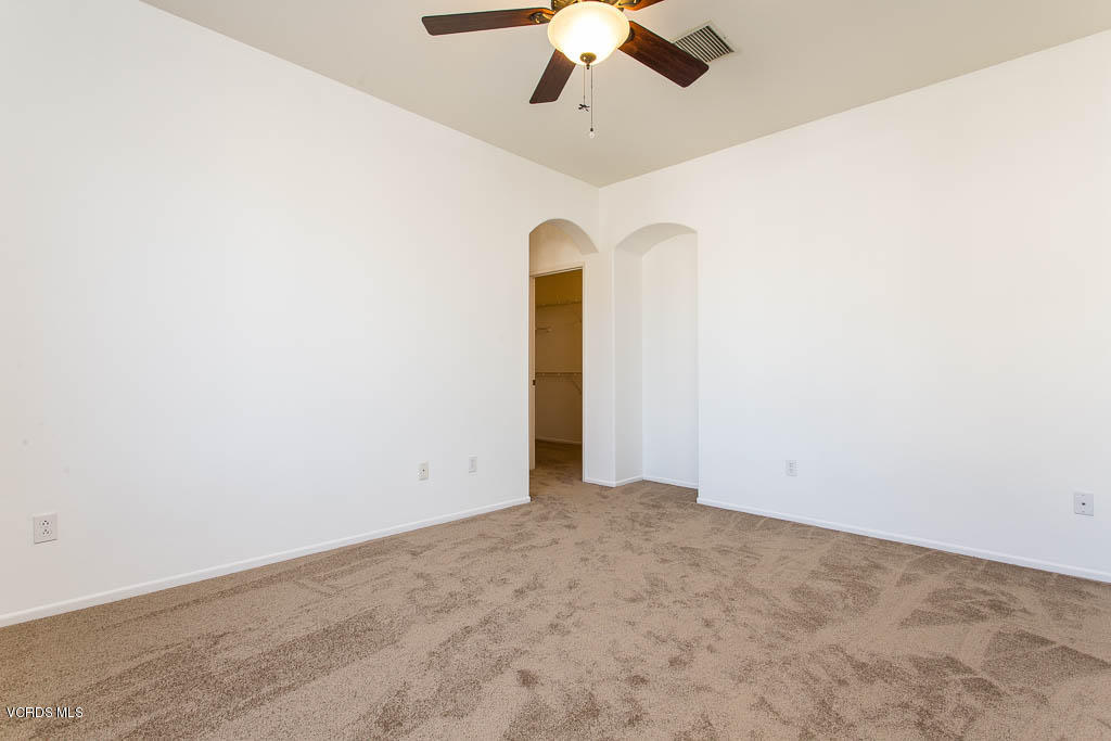 74 Bending Branch Way Simi Valley, CA 93065 - Photo 30 of 41 an empty room with a ceiling fan