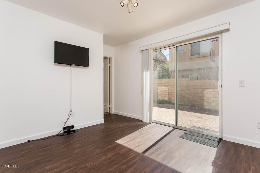 74 Bending Branch Way Simi Valley, CA 93065 - Photo 36 of 41 a view of a livingroom with wooden floor and a flat screen tv