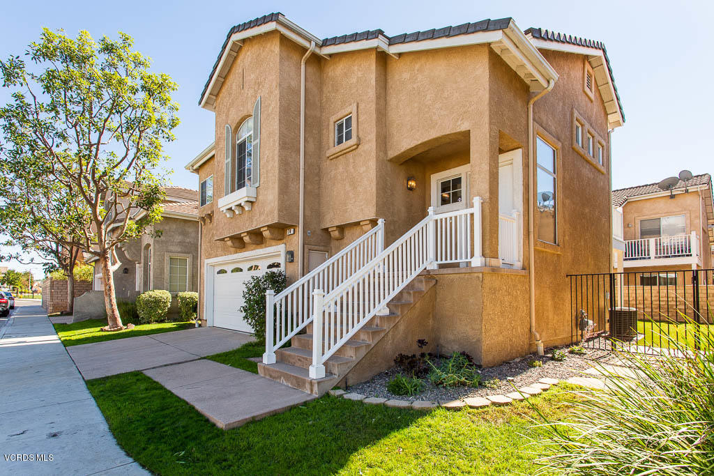 74 Bending Branch Way Simi Valley, CA 93065 - Photo 6 of 41 a view of a house with a small yard and flower plants