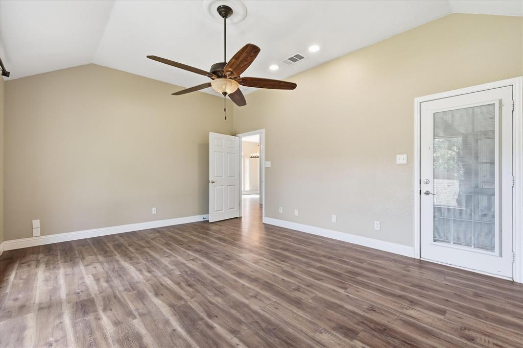 289 County Road 1170 Decatur, TX 76234 - Photo 20 of 40 Alternate angle of Primary Bedroom showing ample wall space for all of your furniture. Private door to your covered back patio.