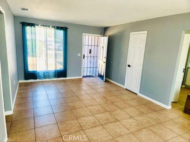 a view of an empty room and window