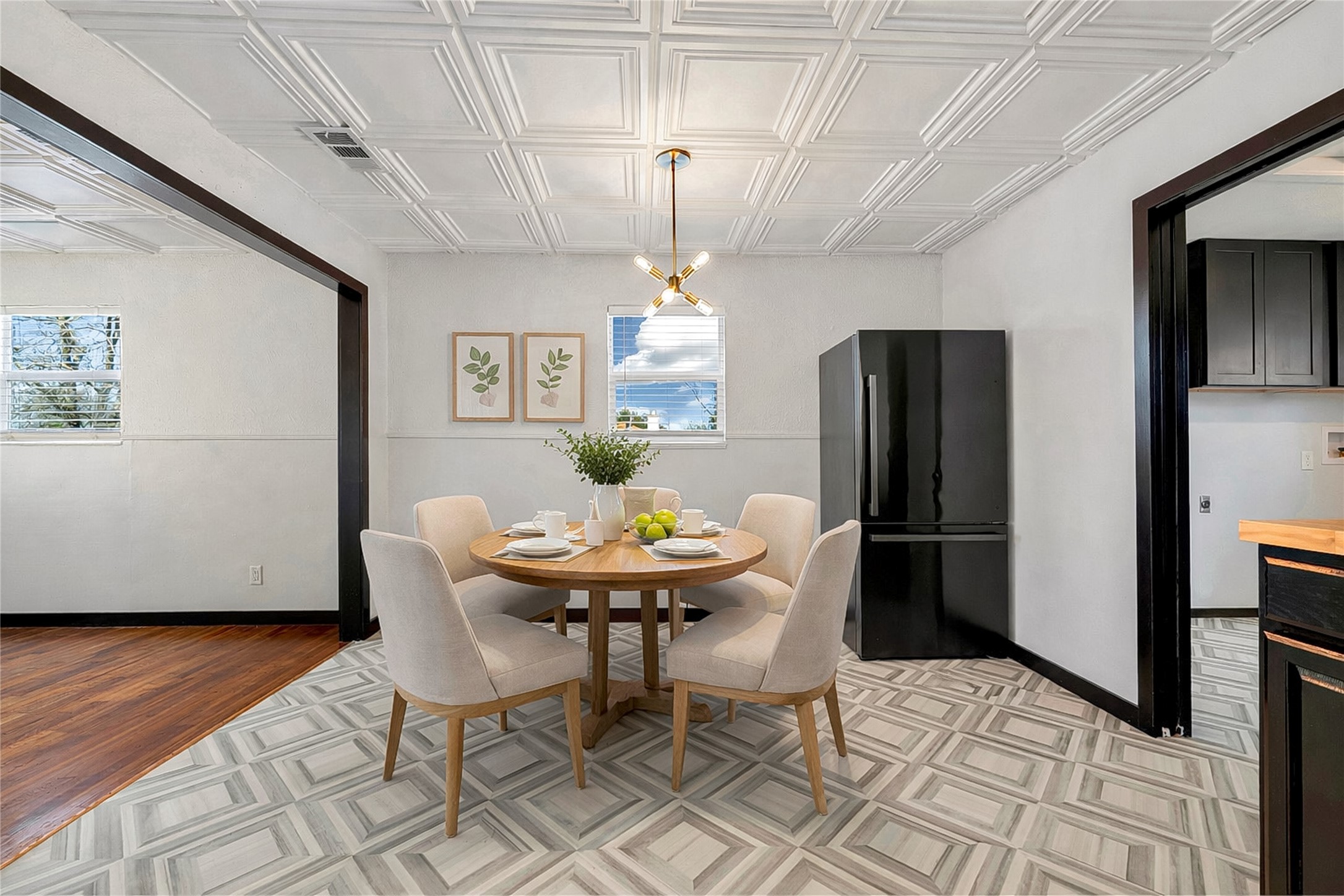6915 Providence Avenue Austin, TX 78752 - Photo 12 of 27 a view of a dining room with furniture and a chandelier