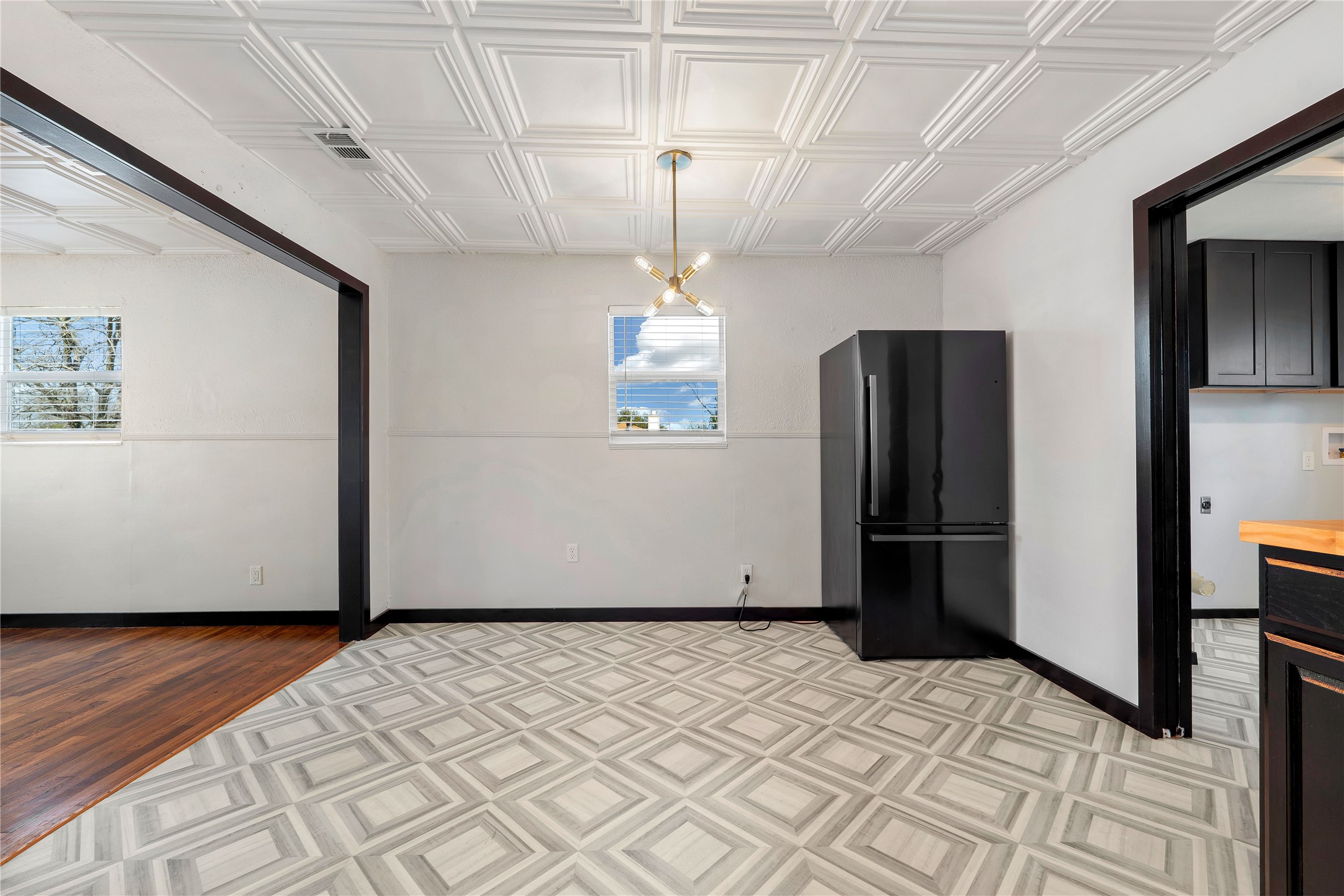 6915 Providence Avenue Austin, TX 78752 - Photo 13 of 27 a view of a refrigerator in wooden floor