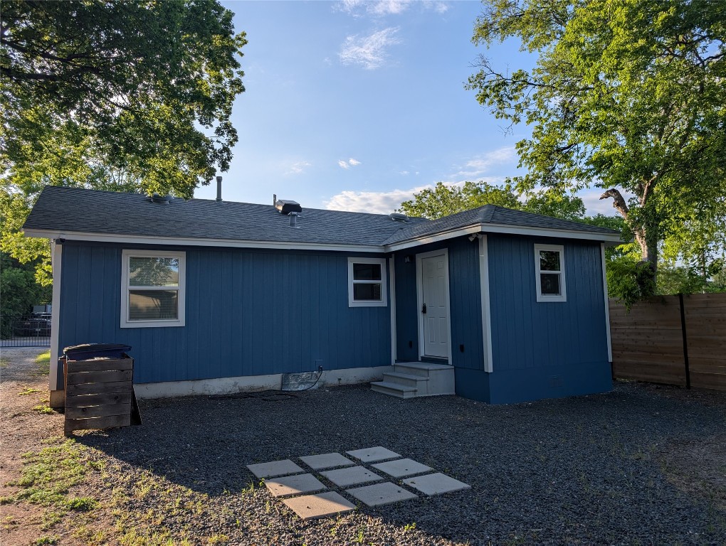 6915 Providence Avenue Austin, TX 78752 - Photo 20 of 27 View of back of home with entry steps and a shingled roof