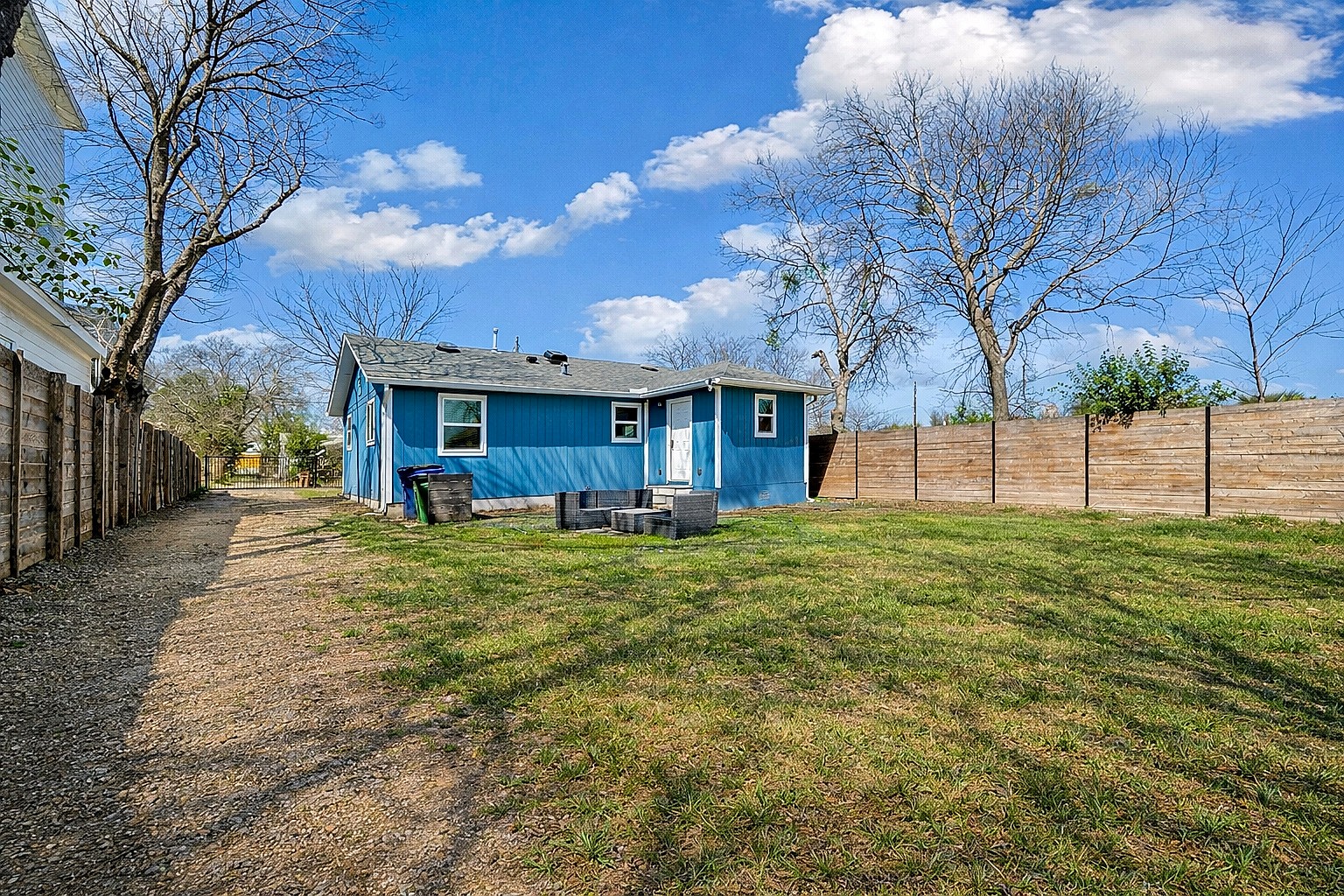 6915 Providence Avenue Austin, TX 78752 - Photo 21 of 27 a view of a house with a backyard
