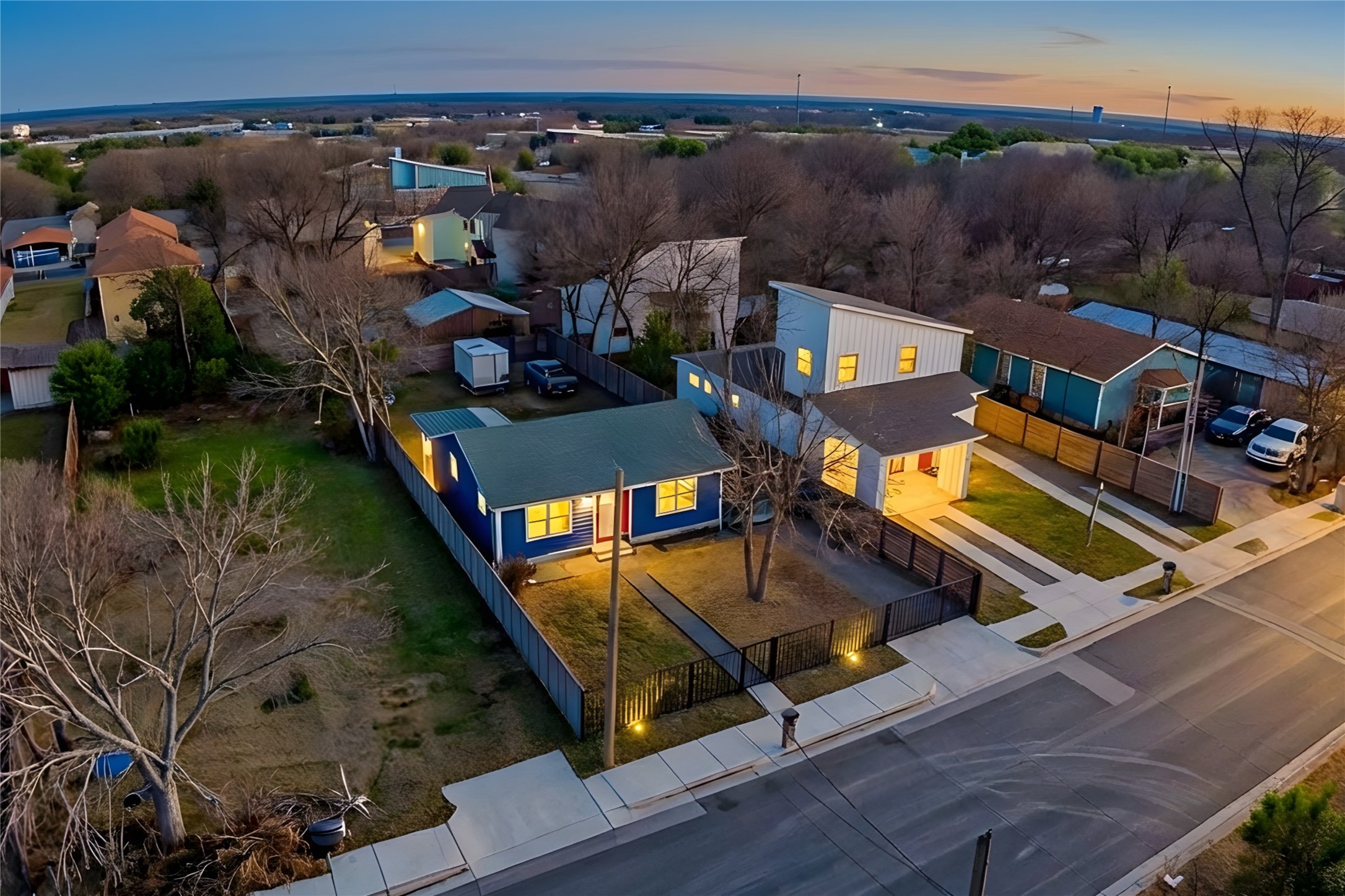 6915 Providence Avenue Austin, TX 78752 - Photo 23 of 27 an aerial view of a house with pool lake view and mountain view