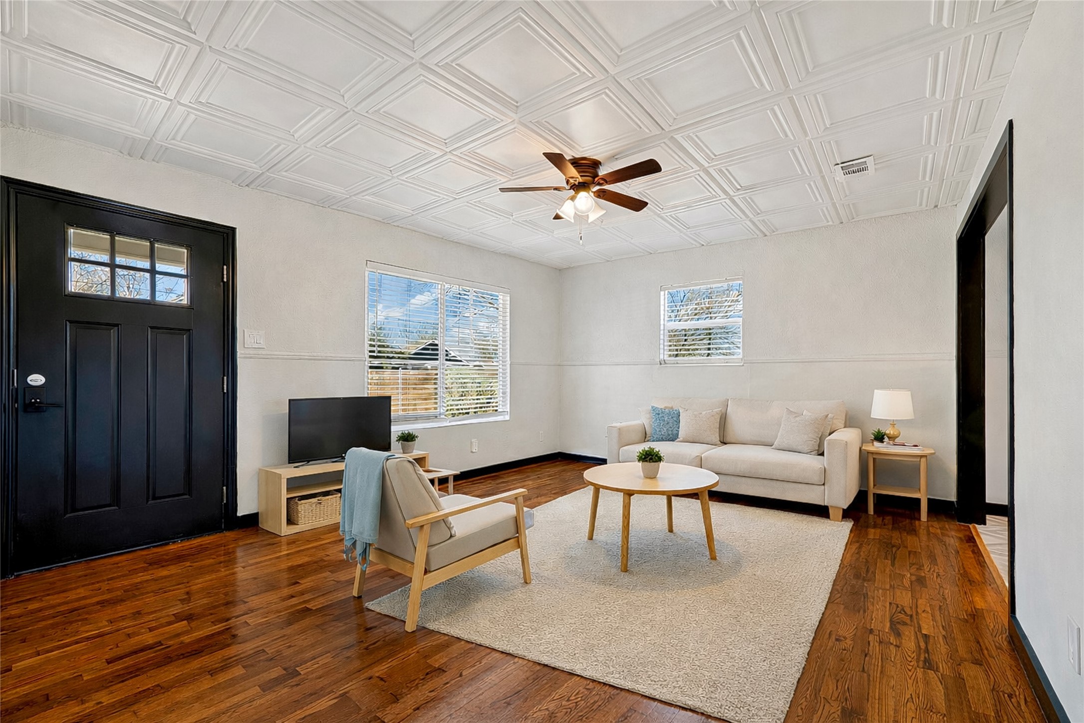 6915 Providence Avenue Austin, TX 78752 - Photo 7 of 27 a living room with furniture and wooden floor