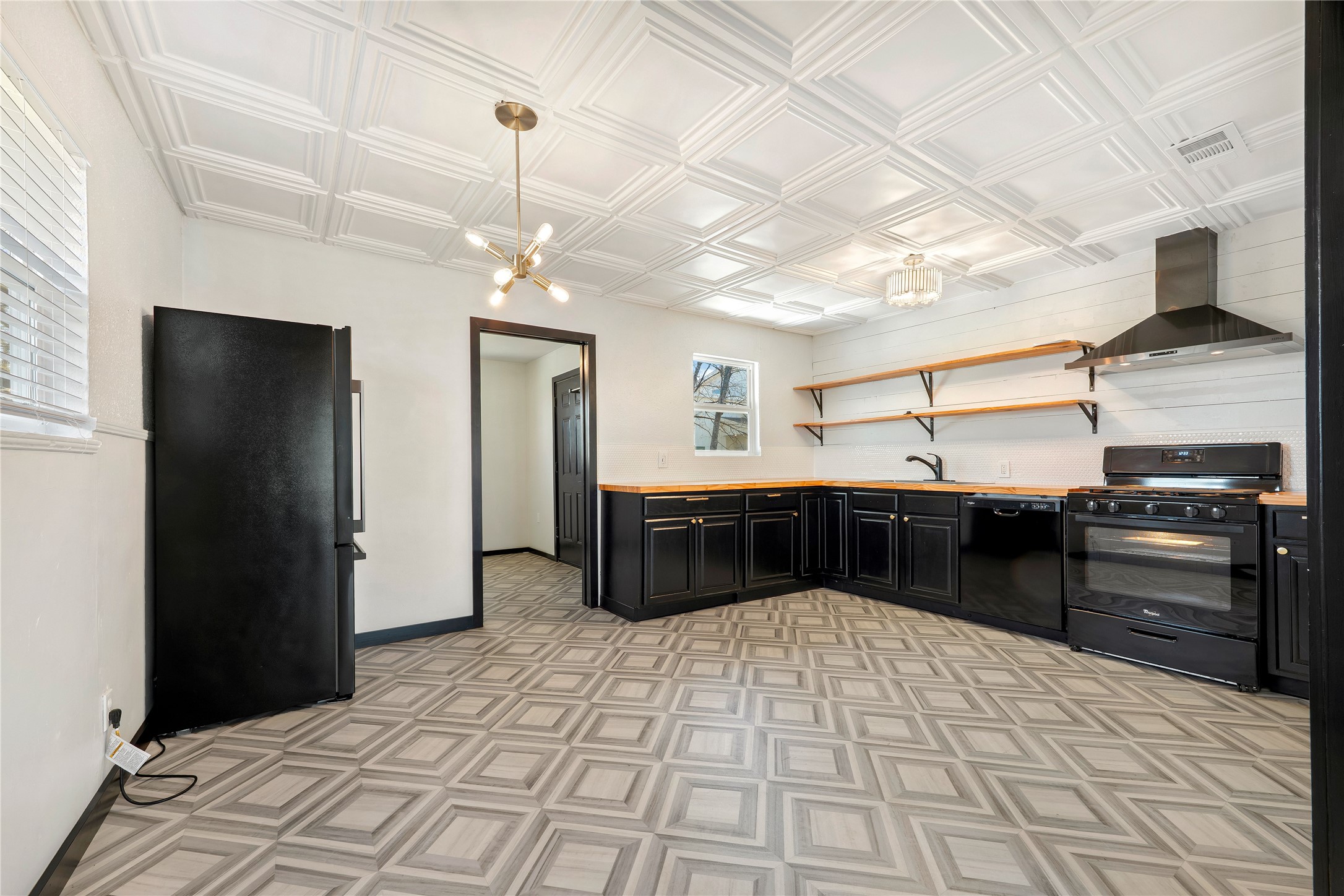 6915 Providence Avenue Austin, TX 78752 - Photo 10 of 27 a kitchen with a stove and a refrigerator