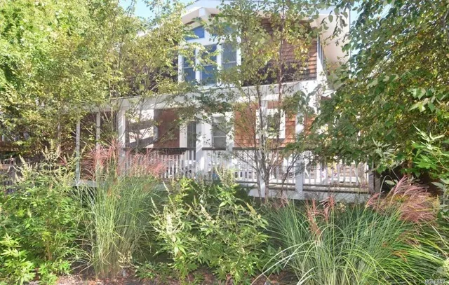 a view of a two chairs in the porch