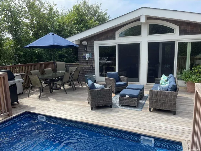 a view of a deck with furniture