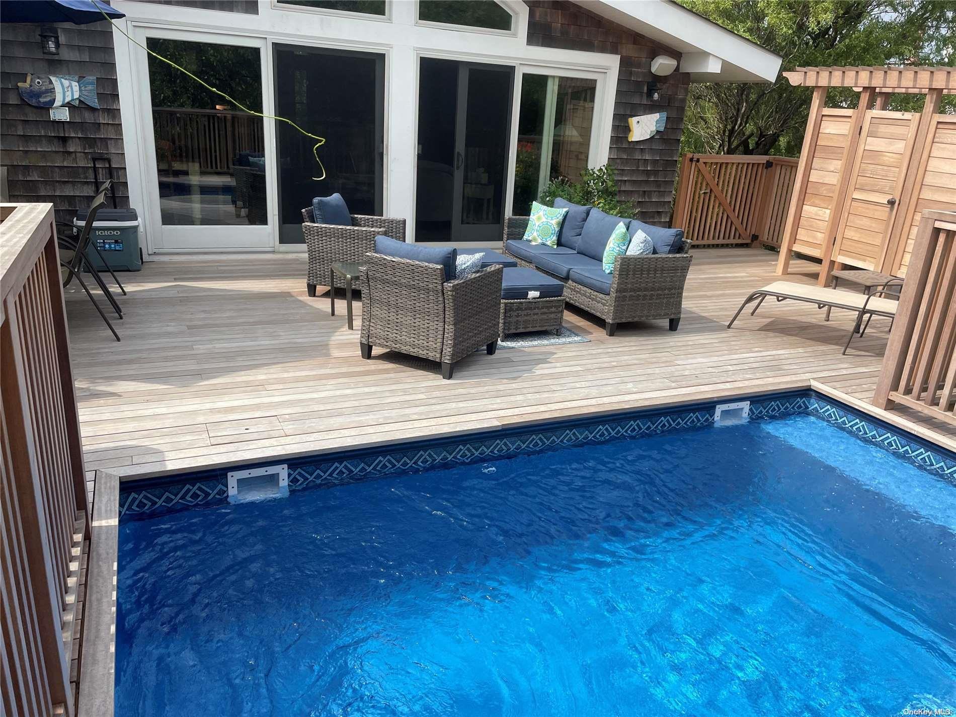 207 Wilmot Road Ocean Beach, NY 11770 - Photo 22 of 24 a view of house with wooden floor and outdoor seating