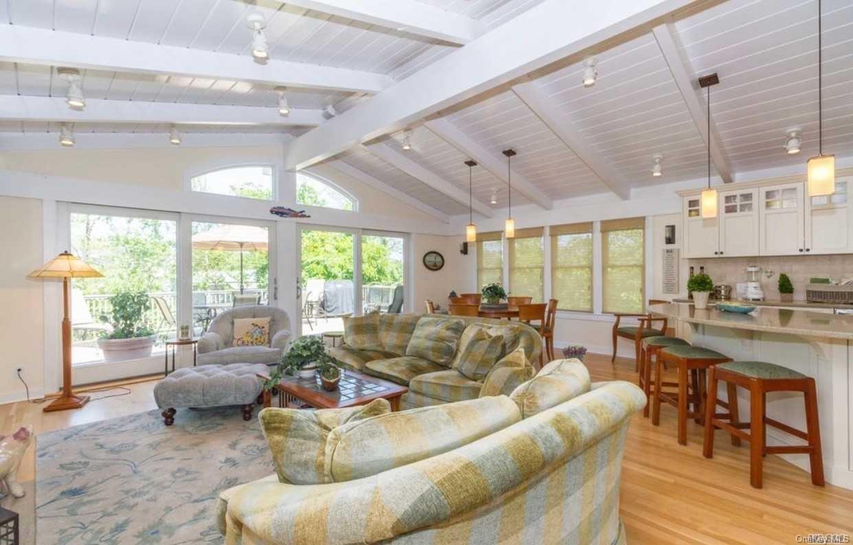 207 Wilmot Road Ocean Beach, NY 11770 - Photo 4 of 24 a living room with furniture and a large window