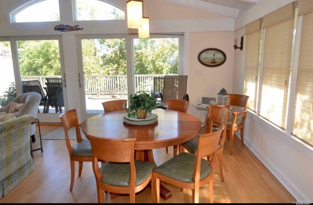 207 Wilmot Road Ocean Beach, NY 11770 - Photo 9 of 24 a view of a dining room with furniture window and outside view