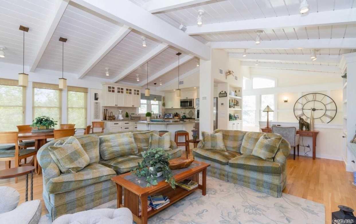 207 Wilmot Road Ocean Beach, NY 11770 - Photo 10 of 24 a living room with furniture and a large window