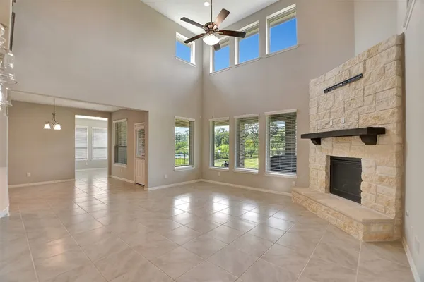 a living room with fireplace furniture and a flat screen tv