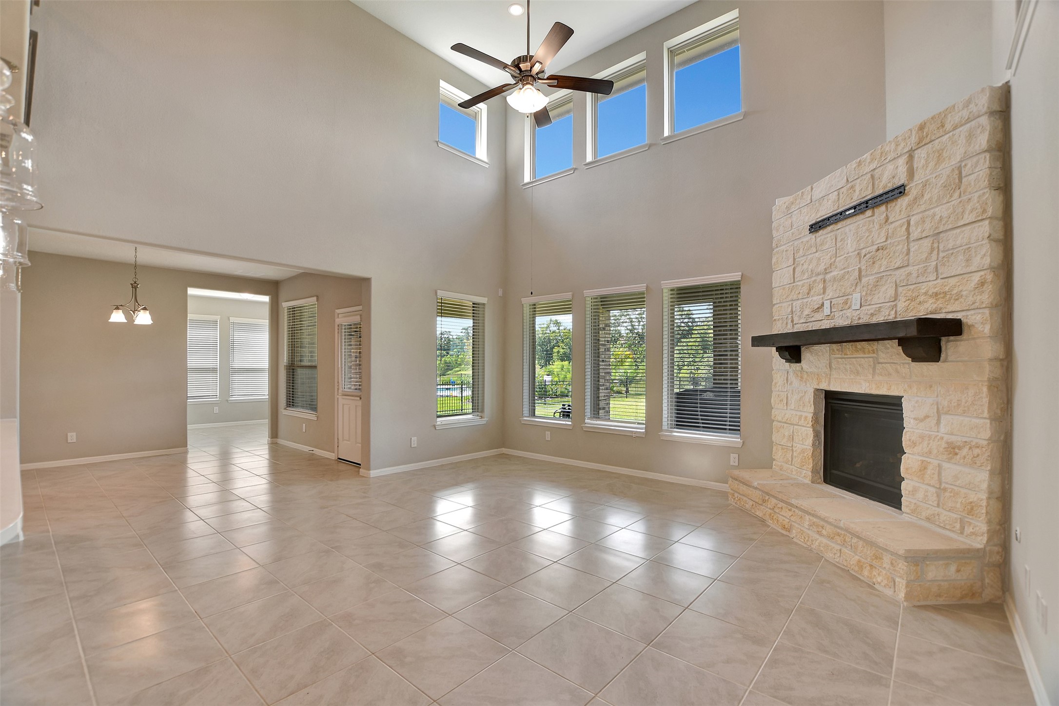 246 Peninsula Point Drive Montgomery, TX 77356 - Photo 14 of 46 Open living room with stone gas fireplace