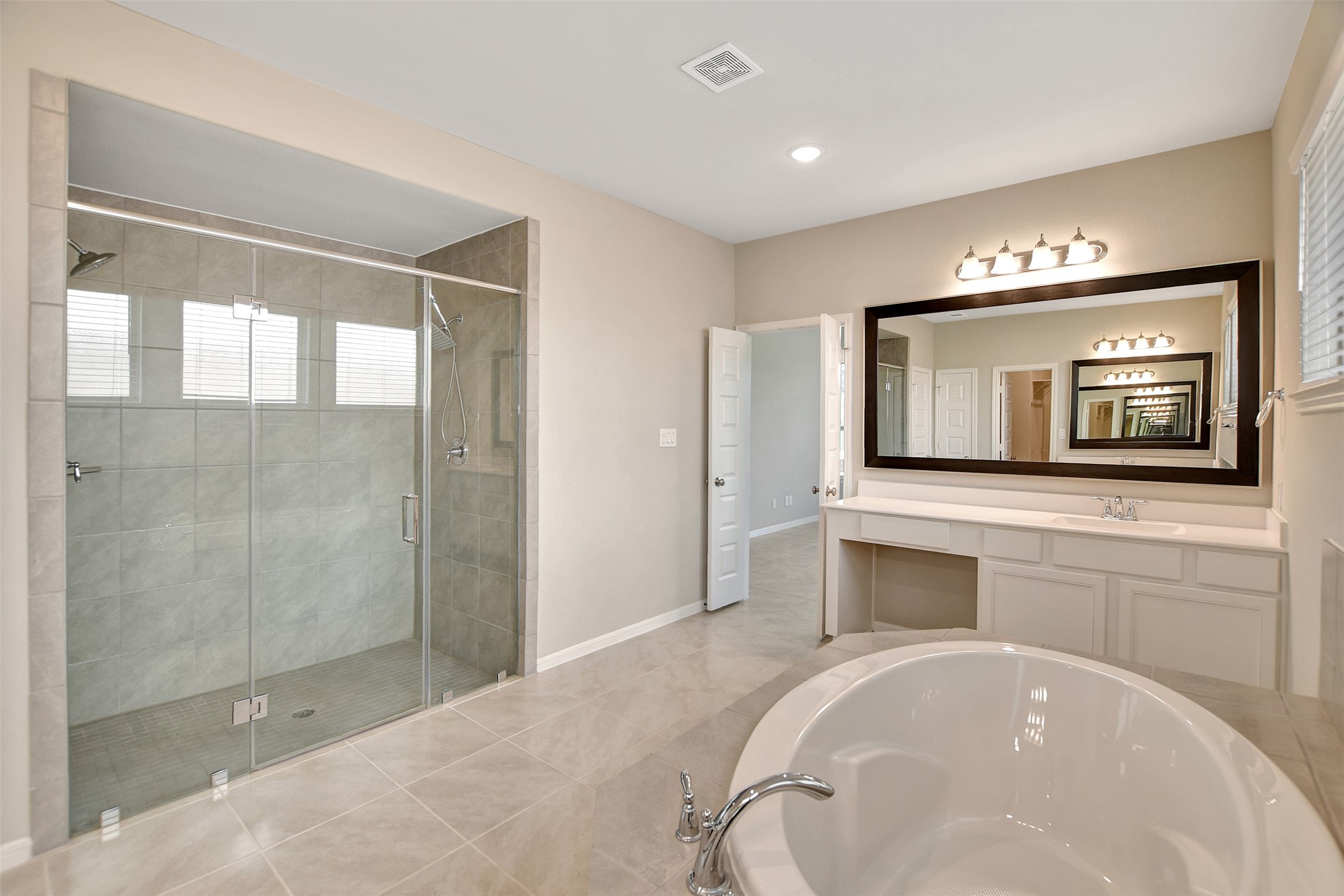 246 Peninsula Point Drive Montgomery, TX 77356 - Photo 23 of 46 Such a large shower and a second sink and counter space on the other side