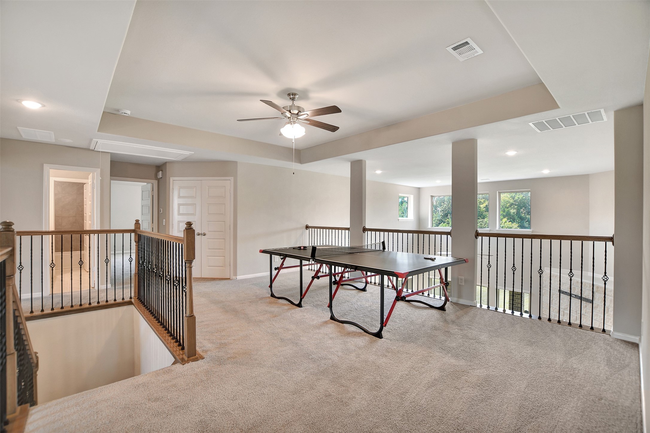 246 Peninsula Point Drive Montgomery, TX 77356 - Photo 25 of 46 The upstairs game room looks out over the living area
