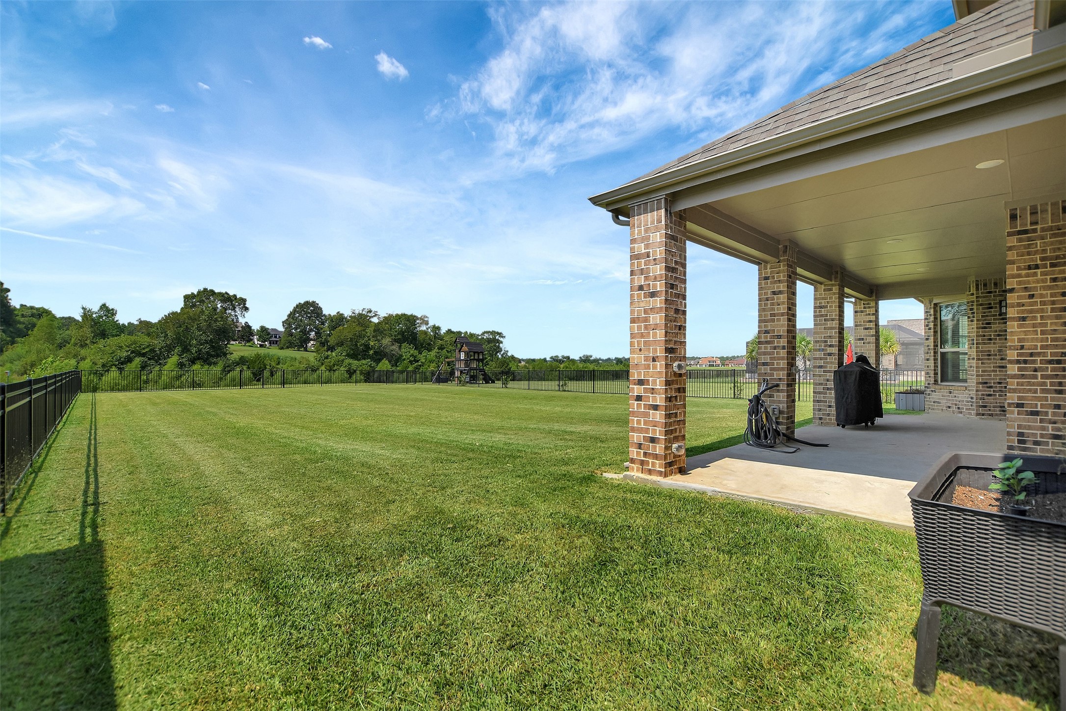 246 Peninsula Point Drive Montgomery, TX 77356 - Photo 36 of 46 Recent wrought iron fencing around the massive backyard