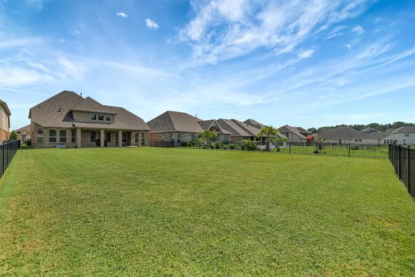 an aerial view of a house with garden space and outdoor seating