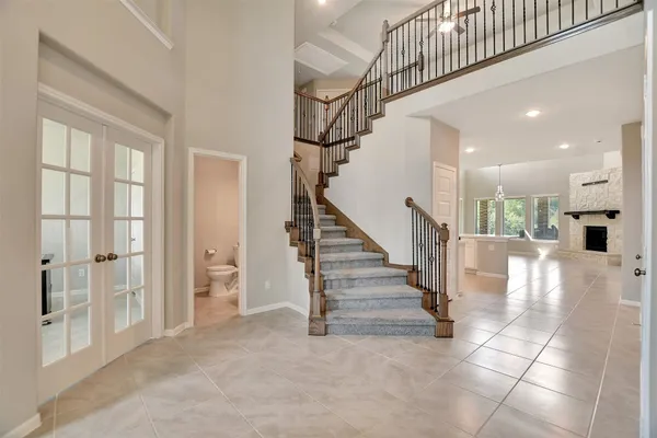 a view of entryway and hall with dining area